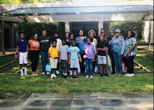 Group of students standing in front of the Carter Presidential Center, Atlanta