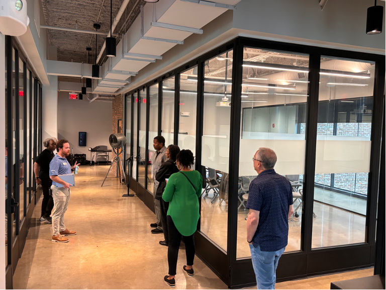 Image of people visiting a co-working space